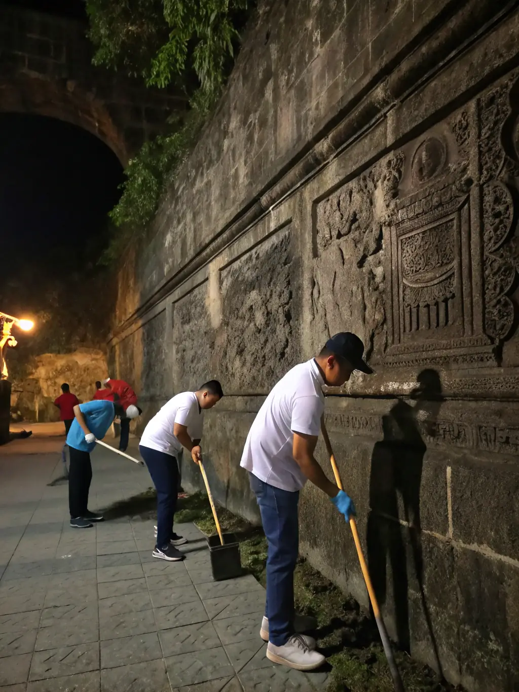 A group of volunteers working on a restoration project inside the basilica, highlighting the hands-on activities supported by the organization.